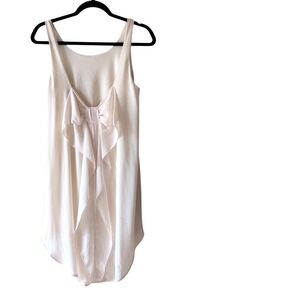 Everly Cream Sleeveless High-Low Dress with Dramatic Back Bow